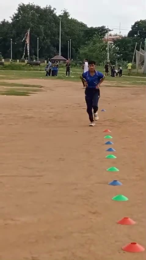 A player running a cone ladder drill