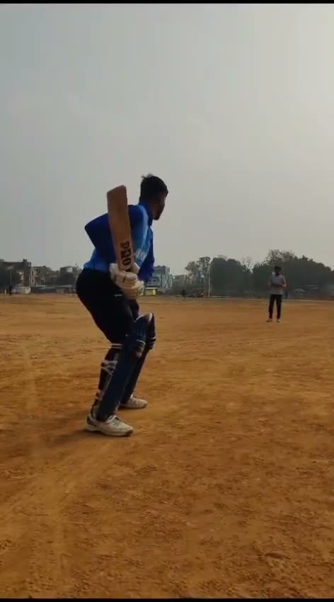 A batter playing a shot out on the ground
