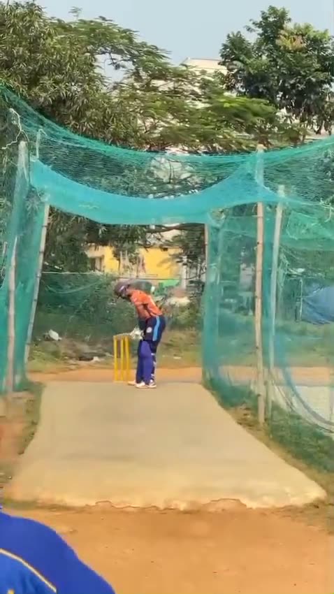 A bowler delivering in the nets