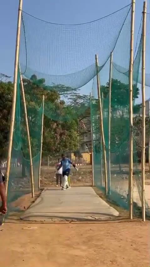 A long net session viewed down the pitch